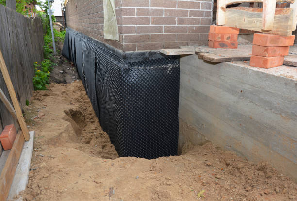 SJ Waterproofing Pros technician performing targeted Sump Pump Installation assessment in Oceanside, NY